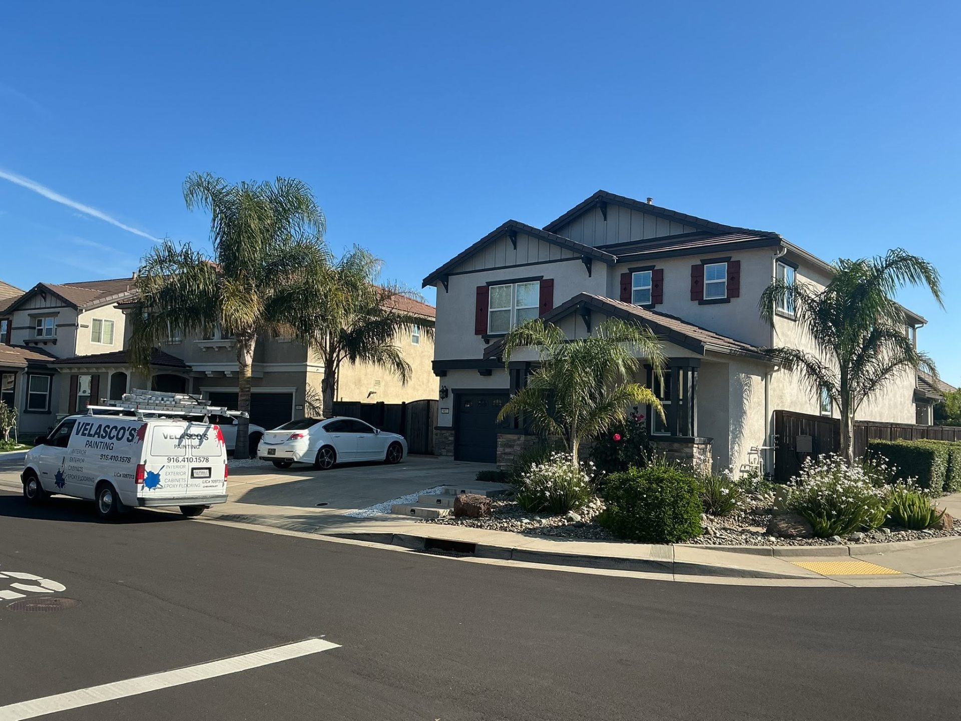 Velasco's Painting van parked at completed craftsman two-story