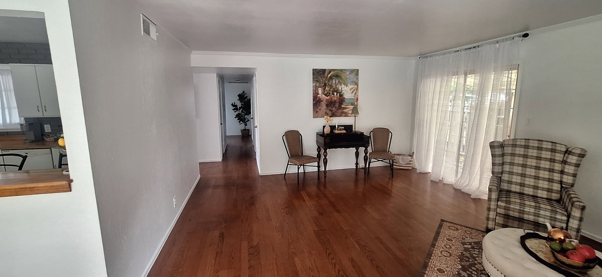Bright white interior repaint with hardwood floors