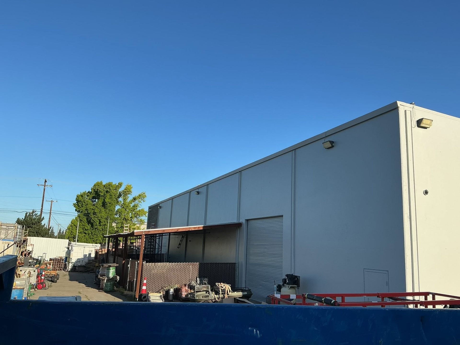 Completed exterior repaint of a large commercial warehouse
