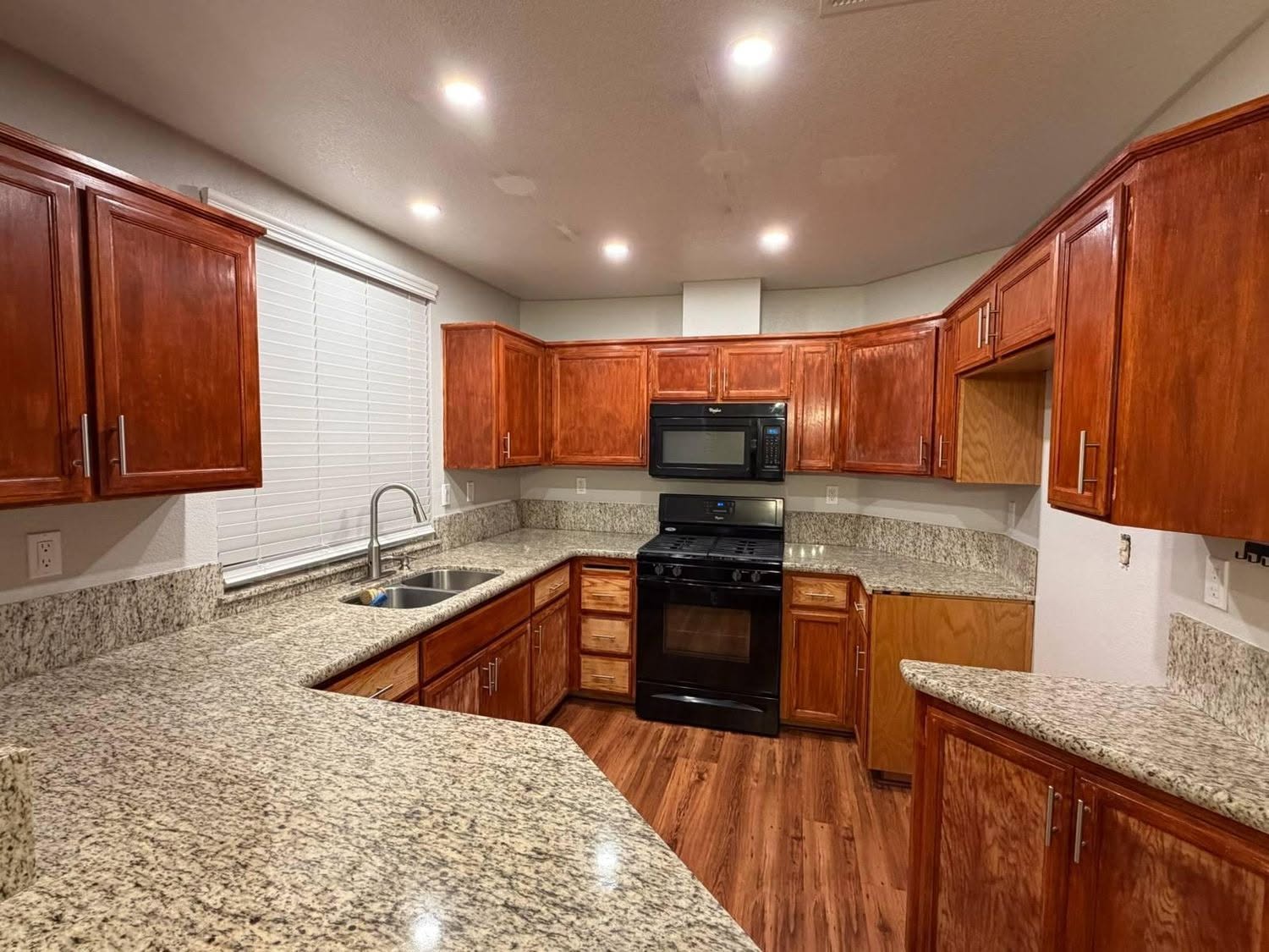 Restored cherry wood cabinets with granite countertops